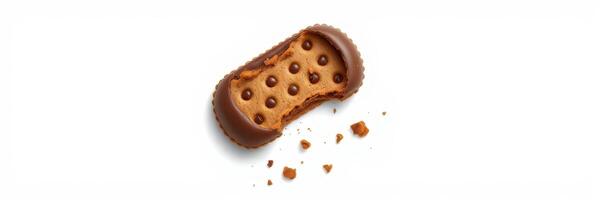 Delicious chocolate-covered cookie with a bite taken out and crumbs scattered around it photo