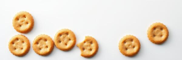 Cookies arranged in a casual pattern on a white table with a bit of uneven spacing creating a playful effect photo