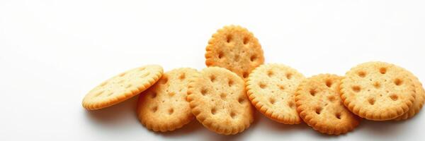 Crunchy round crackers arranged in a casual pile on a plain white surface photo