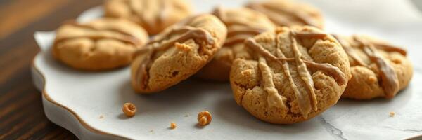 Homemade peanut butter cookies arranged on a decorative plate with a rustic wooden background photo