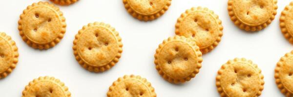 Snack crackers arranged in a playful pattern on a white background showcasing their golden-brown texture photo