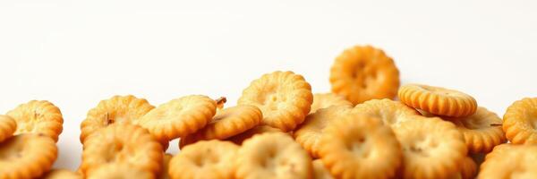 Assorted crispy crackers scattered on a plain background suitable for snacking and culinary use photo