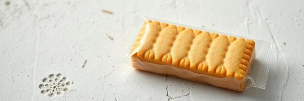 Delicious shortbread biscuit placed on a light textured surface in a cozy kitchen setting photo