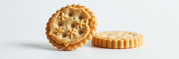 Cookies stacked on white background showcasing their textured design and circular shape with decorative edges photo