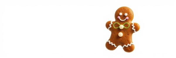 Gingerbread cookie decorated with icing and candy details displayed on a clean white background during holiday season photo