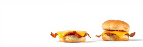 Delicious breakfast sandwiches with melted cheese and crispy bacon on a white background ready to eat photo