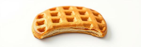 Waffle sits on a plain surface highlighting its perfect texture and golden brown color photo