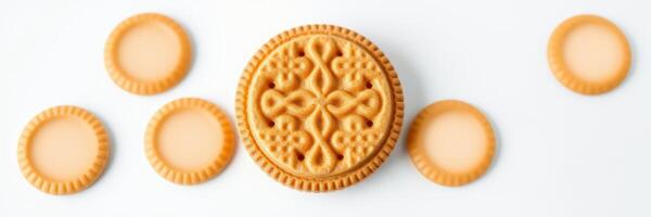 Cream-filled cookies arranged on a white background attractively for a tasty treat display photo