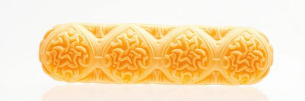 Ornate yellow decorative object showcasing intricate design patterns and textures against a neutral background photo
