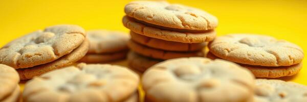 Cookies stacked neatly on a bright yellow background in a cheerful and inviting arrangement photo