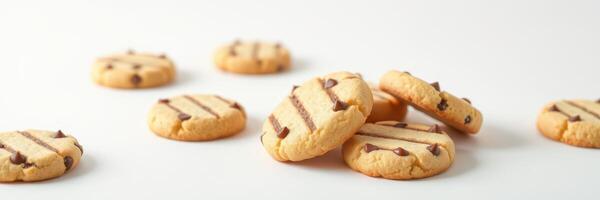 Freshly baked cookies with chocolate chips arranged on a light surface photo