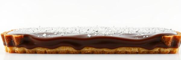 Delicious chocolate tart with a smooth filling and a dusting of powdered sugar on a clean white background photo