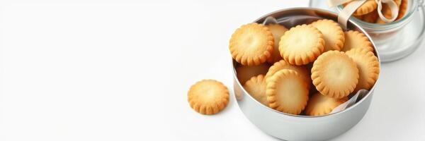 Collection of golden brown cookies in a silver tin on a white background showcasing a delicious snack photo