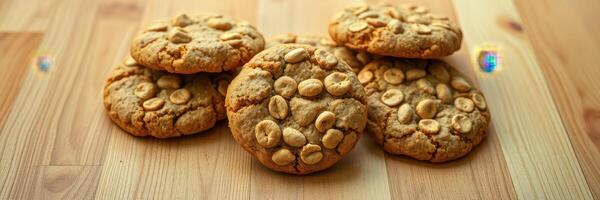 Freshly baked peanut cookies arranged on a wooden surface ready to be enjoyed with coffee or tea photo
