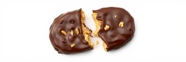 Chocolate coated peanut butter cookie broken in half on white background photo