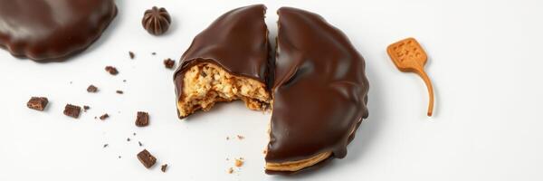 Delicious chocolate dessert featuring a decadent filling on a white plate with crumbs and a small spoon photo