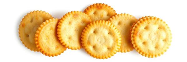 Crunchy round crackers arranged in a line on a plain background showcasing their texture and colors photo