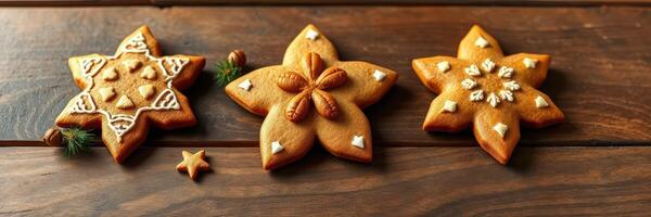 Homemade gingerbread cookies shaped like stars decorated with icing and sugar placed on a wooden surface photo