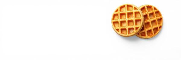Delicious golden waffles served fresh on a clean white surface waiting to be topped with syrup or fruit photo