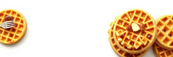 Delicious stacked waffles served with syrup and butter for a delightful breakfast experience photo