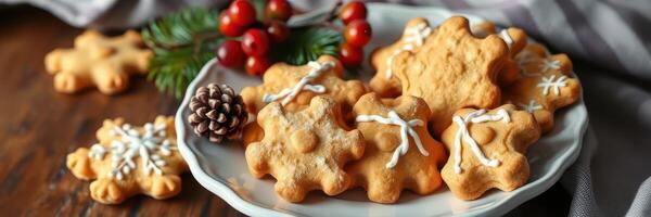 Delicious holiday cookies arranged on a decorative plate with seasonal decorations and a rustic wooden background photo