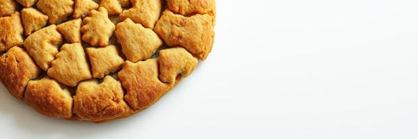 Warm golden cookie with uneven texture served on a neutral background perfect for a cozy dessert experience photo
