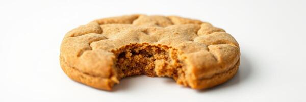 Delicious freshly baked cookie with a bite taken out displayed on a plain background photo