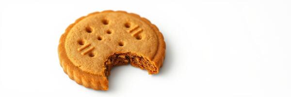 Sweet biscuit with a bite taken out, resting on a plain surface in a well-lit space photo