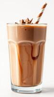 Smooth chocolate milkshake topped with caramel and a striped straw served in a tall glass at a cozy dessert shop photo