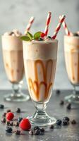 Delicious milkshakes topped with fruits and cream served in elegant glasses at a cozy cafe photo