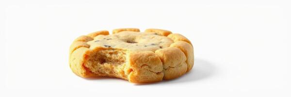 Delicious cookie with a bite taken out, featuring a soft center and golden brown edges displayed against a clean background photo