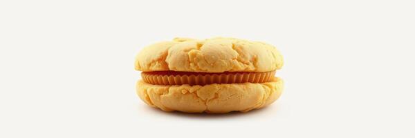 Unique orange dessert sandwich with cream filling displayed against a plain background photo