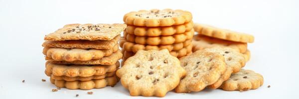 Assorted crunchy cookies stacked and scattered on a white background, perfect for snacking or dessert photo