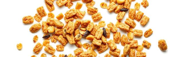Delicious crunchy cereal pieces scattered on white background for healthy breakfast options photo