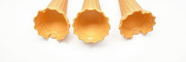 Ice cream cones arranged in a row showcasing the classic waffle design and vibrant colors on a simple background photo