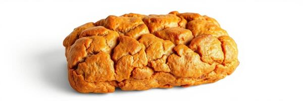 Freshly baked bread loaf with a golden crust on a white background showcasing its unique texture and shape photo