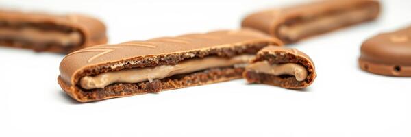 Chocolate bars with creamy filling arranged on a white surface showcasing their delicious texture and design photo