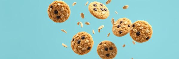 Delicious cookies flying through the air against a vibrant blue background during a creative food presentation photo