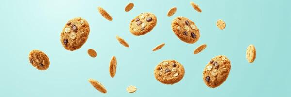 Cookies float weightlessly in the air, showcasing their deliciousness and texture against a soft blue background photo