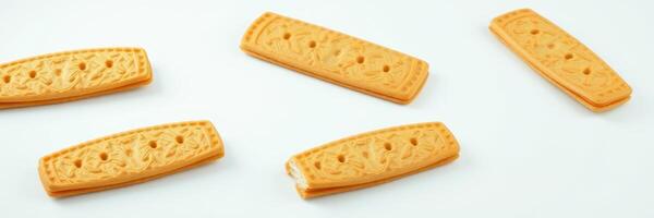 Unique orange treats with intricate designs on a white background suitable for party snacks or gatherings photo