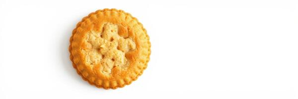 Cookie with intricate design placed on a plain white background highlighting its texture and shape in natural light photo
