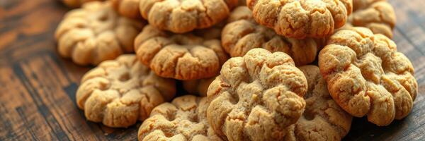 Freshly baked cookies arranged on a wooden table, showcasing a delightful homemade treat ideal for gatherings and snacks photo