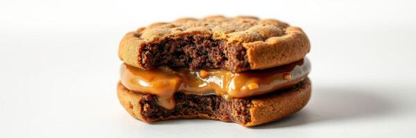 Delicious dessert sandwich made of chocolate cookies and sweet caramel filling photo