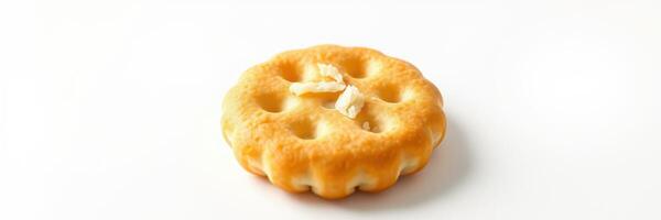 Unique round cracker with light golden color and distinct texture displayed against a white background photo
