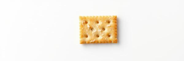Crunchy square cracker on a plain white background highlighting its texture and shape for culinary presentation photo
