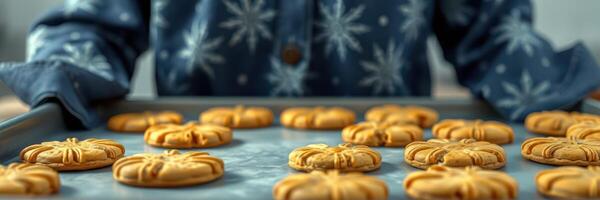 Cookies baked during a festive season with intricate designs on a tray prepared in a cozy kitchen setting photo