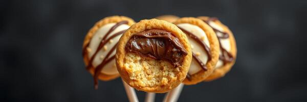 Delicious cookies filled with chocolate and topped with creamy frosting prepared for a sweet treat photo