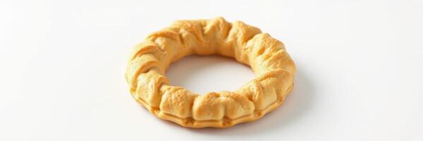 Unique round pastry with a textured surface showcased on a plain background ideal for culinary presentation photo