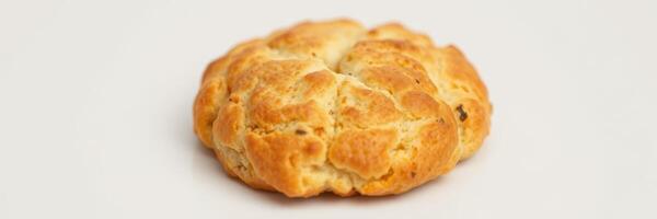 Deliciously baked bread roll showcasing a golden crust and fluffy texture, perfect for any meal or snack photo