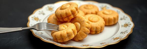 Delicious homemade cookies served on a decorative plate with a fork ready to enjoy photo